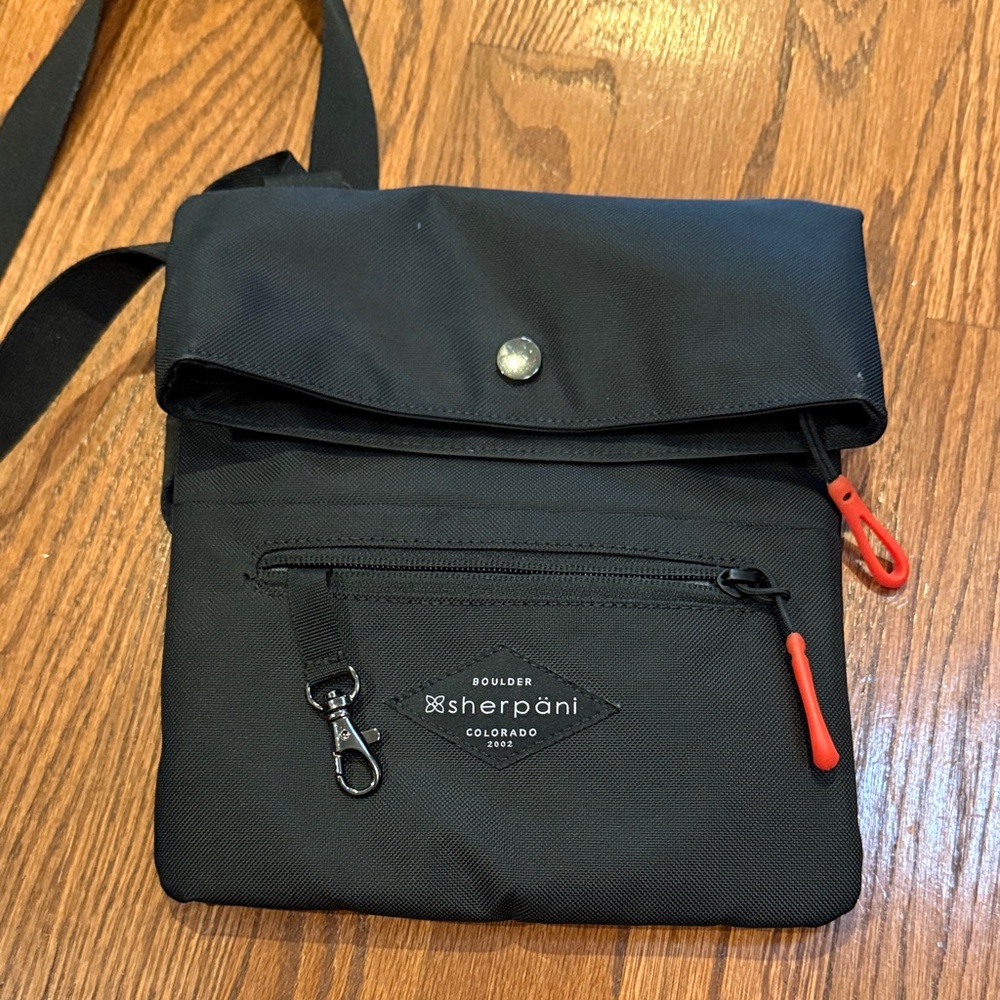 Sherpani Black Messenger Bag with Red Accents